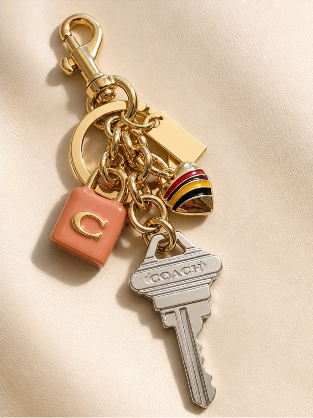 Coach Gold-Tone Key & Enamel Charm Cluster in Peach, Black, Red, Yellow